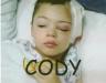 Dakota  - This is Cody the day after his brain surgery, eating a grilled cheese sandwich...